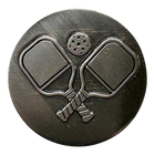 Pickleball paddles icon in silver on black